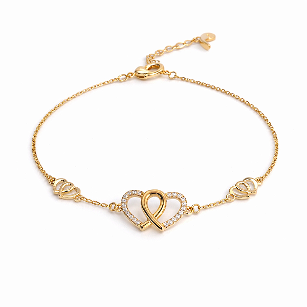 PULSEIRA DOURADA COM 3 CORAÇÕES ENTRELAÇADOS, DO MEIO COM ZIRCÔNIAS BRANCAS - 17CM + 3CM EXTENSOR