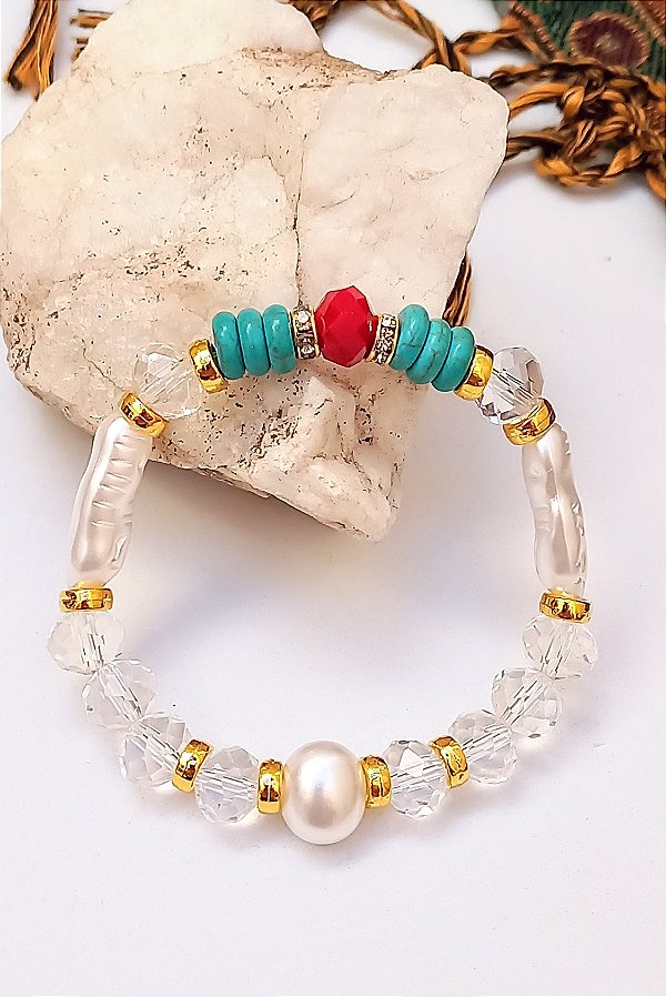 Pulseira Pérolas e Transparência.