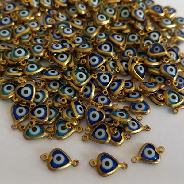 ACESSORIO NO BRUTO PRONTO PARA O BANHO (CX05) - OLHO GREGO DE CORAÇÃO COM DUAS ARGOLINHAS - PESO 0,2GR - (VENDAS POR UNIDADE) BRU3838