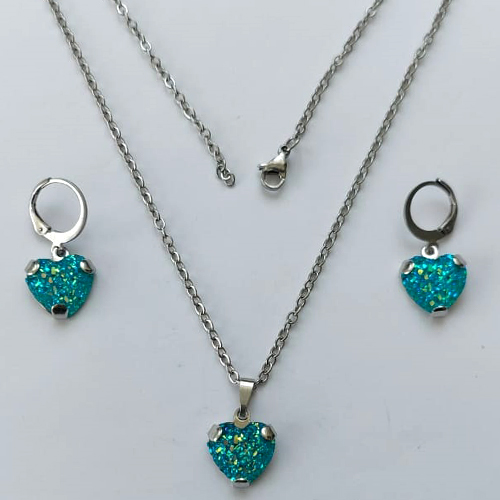 CONJUNTO EM AÇO INOXIDÁVEL - (AÇO03) CONJUNTO COM CORRENTE 50CM E BRINCOS ARGOLINHA DE PRESSÃO COM PINGENTES CORAÇÃO EM CRISTAL COM GLITTER 12MM - COMPOSIÇÃO: AÇO INOXIDÁVEL - AÇO2080