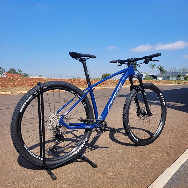 BICICLETA OGGI 29 BW 7.3 DEORE 12V AZUL/CINZA 2025