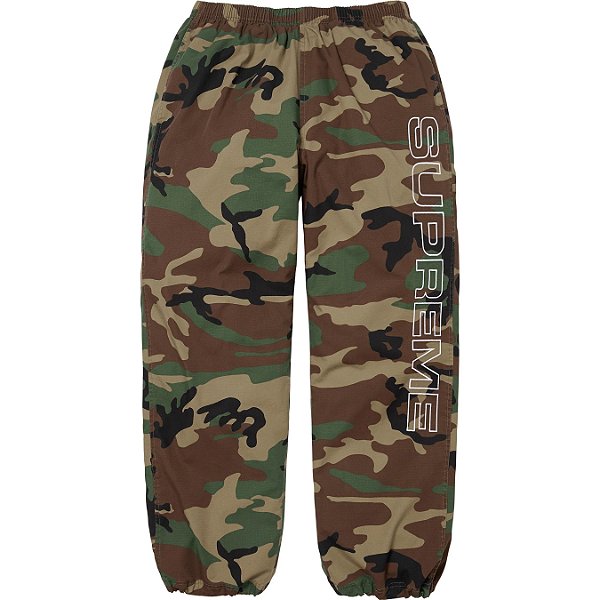 SUPREME - Calça Spellout Embroidered Ripstop Track "Camo" -NOVO-