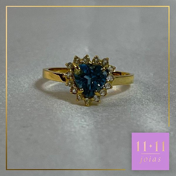 ANEL CORAÇÃO TOPÁZIO SKY E INCOLOR PRATA 950 COM BANHO DE OURO