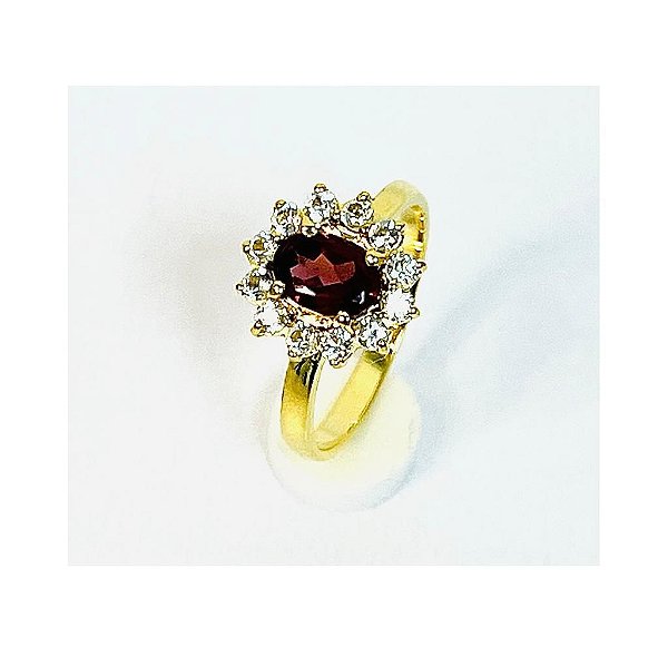 ANEL GRANADA COM 12 TOPÁZIOS INCOLORES