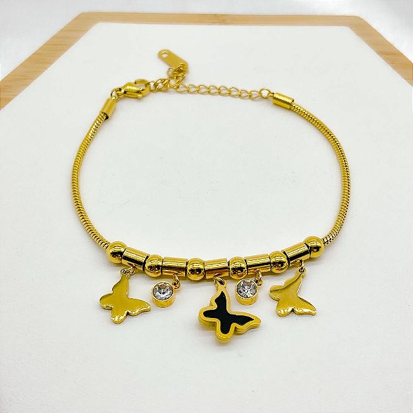 PULSEIRA COM BERLOQUES AÇO INOX  PONTO DE LUZ E BORBOLETA PRETA - DOURADA