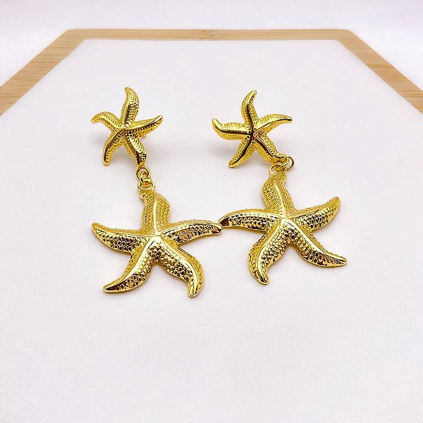 BRINCO AÇO INOXIDÁVEL ESTRELA DO MAR COM DETALHES - DOURADA