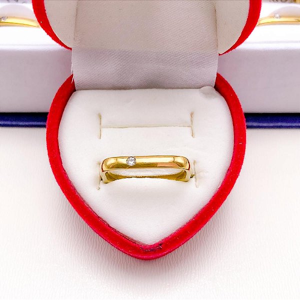 ALIANÇA ACO INOXIDAVEL QUADRADA COM PEDRA CRISTAL - DOURADA (UNIDADE)