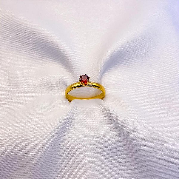 ANEL TIPO SOLITÁRIO DOURADO - PEDRA VERMELHA (UNIDADE)