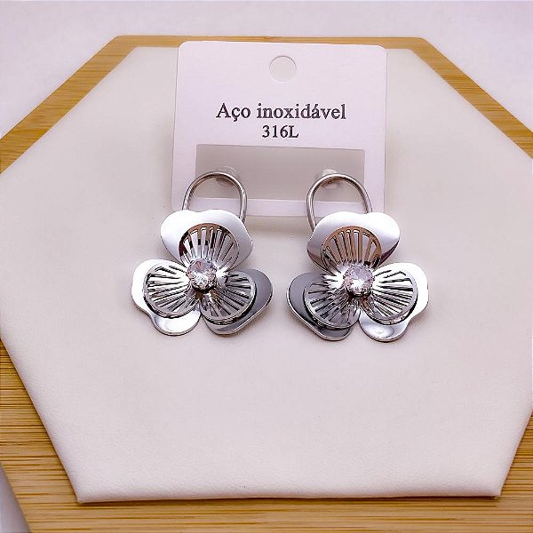 BRINCO AÇO INOX  FLOR COM PEDRA CRISTAL - PRATEADO