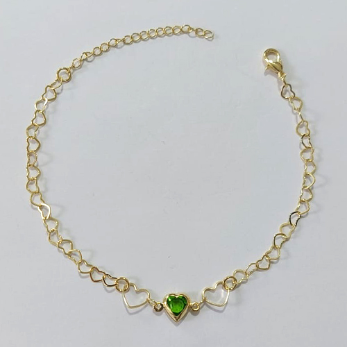 PULSEIRA FOLHEADA A OURO - BANHADO COM 3 MILÉSIMOS + VERNIZ DIAMOND 17CM CORAÇÃO COM PEDRA CRISTAL VERDE E CORAÇÕES VAZADOS + EXTENSOR OUPS000040