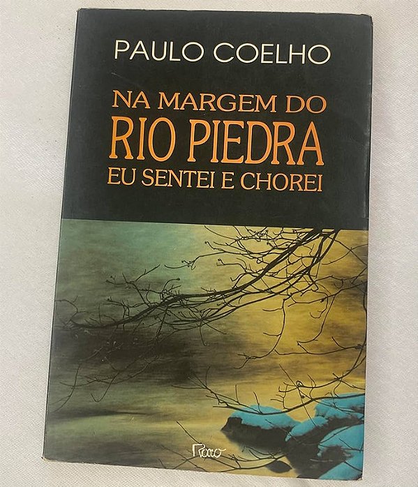 MARGEM DO RIO PIEDRA EU SENTEI É CHOREI - COLEÇAO PAULO COELHO