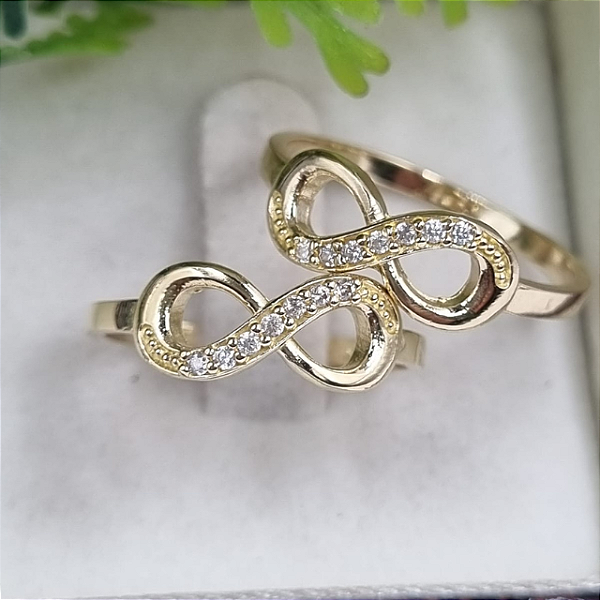 Anel  moeda antiga infinito com zirconia