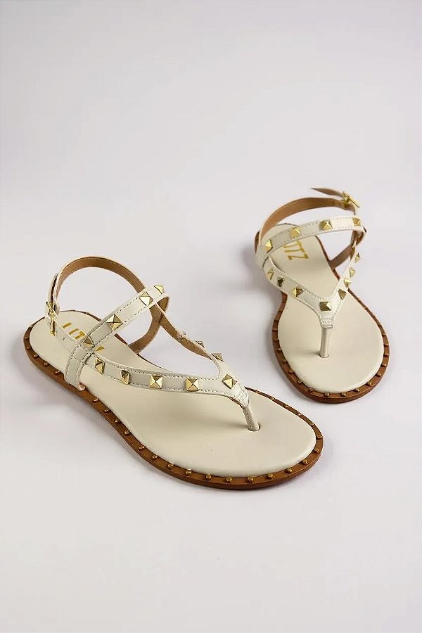 Sandália Feminina Littz Rasteira Tira Com Spikes E Fivela Off White/Ouro