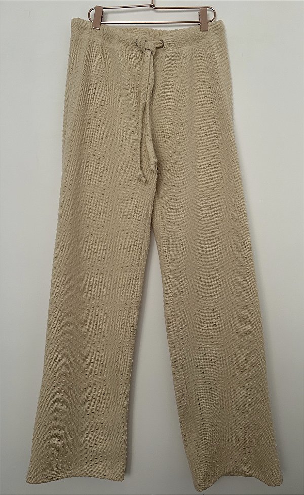 Calça tricot textura bolso atrás