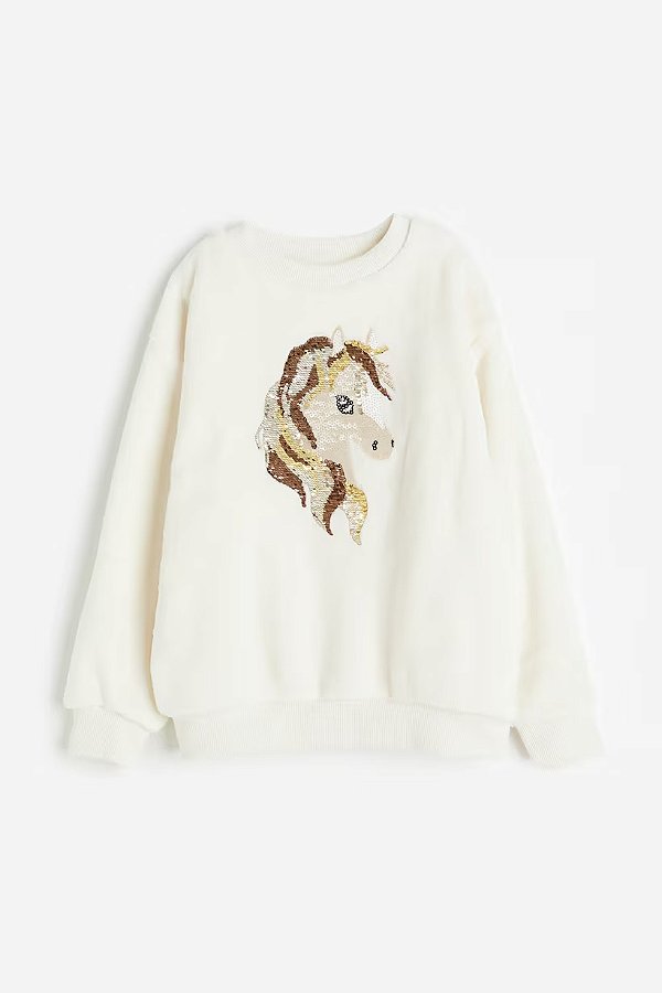 BLUSA PELUCIADA H&M - PONEY PAETÊ - MENINA
