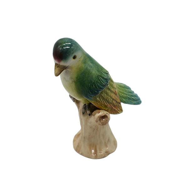 Mini pássaro verde no tronco