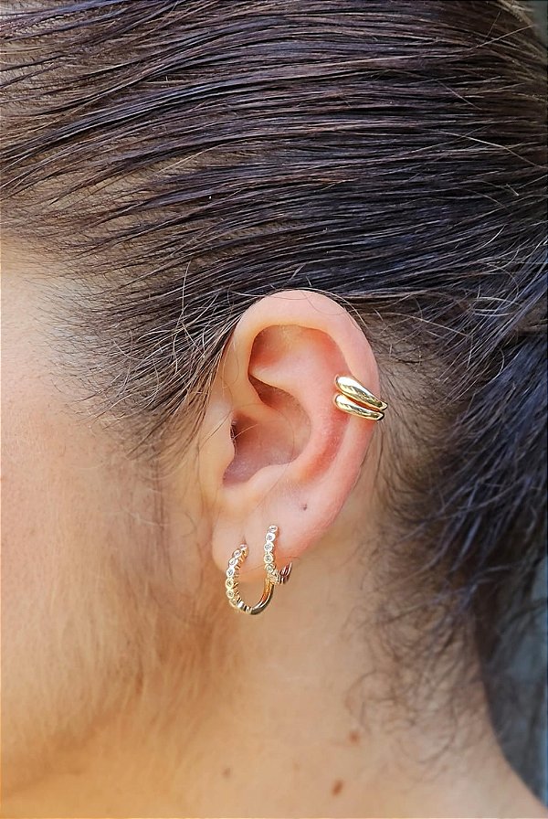 Piercing fake duas garras dourado