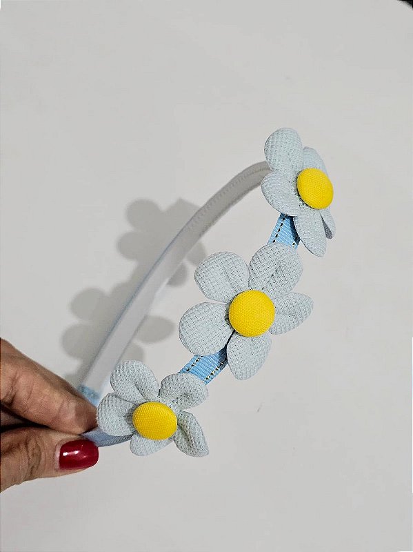 Tiara azul margaridas