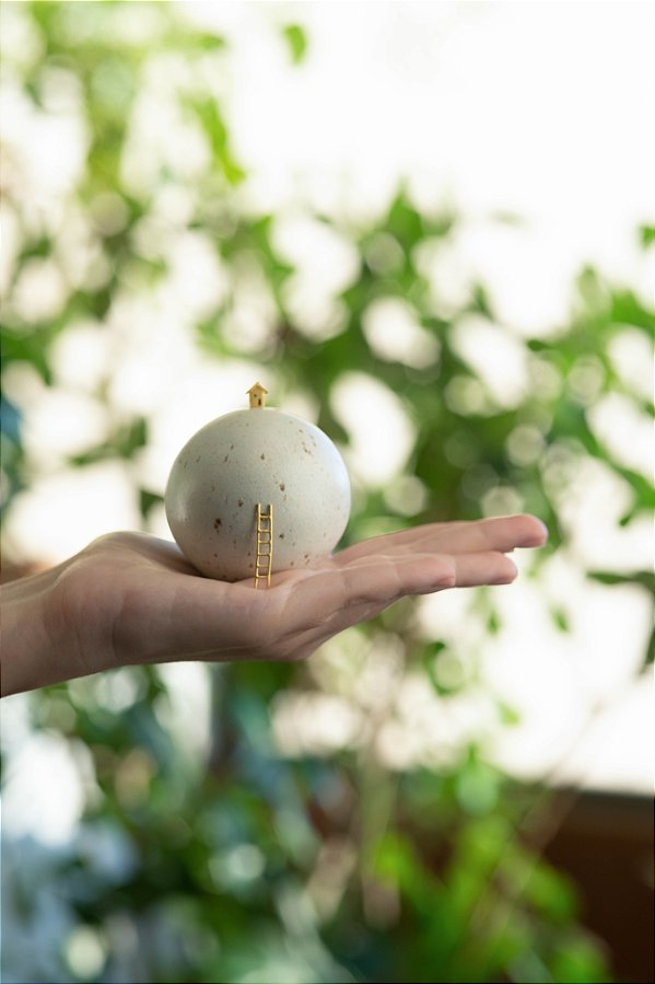 escultura mundinho mini sobre a chegada