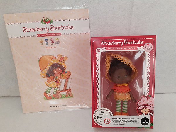 Moranguinho afro laranjinha da coleção de Agostini na caixa , com revista