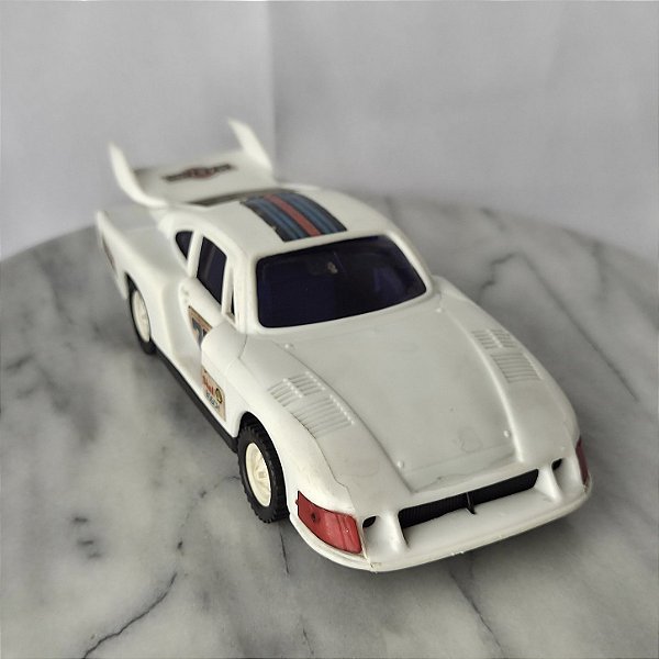 Porsche Branco da Glasslite 1985 com fricção, falta listra no capo e o vidro traseiro tem rachadura, 22 cm