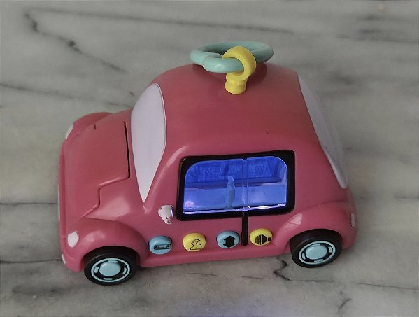 Carrinho de plástico Pixel Chix rosa com luz ,som , fala em português, 9 cm, Mattel 2005