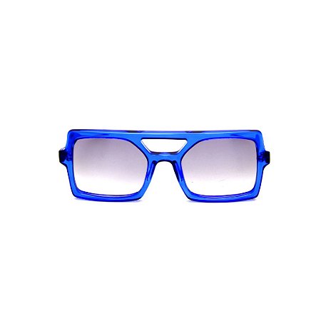 Óculos de Sol Gustavo Eyewear G114 1. Cor: Azul translúcido. Haste preta. Lentes cinza.