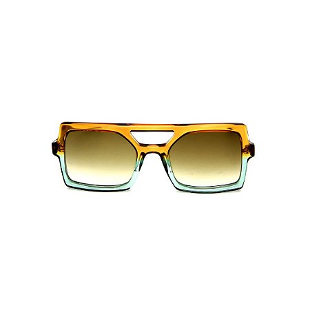 Óculos de Sol Gustavo Eyewear G114 13. Cor: Caramelo e acqua translúcido. Haste animal print. Lentes verdes.