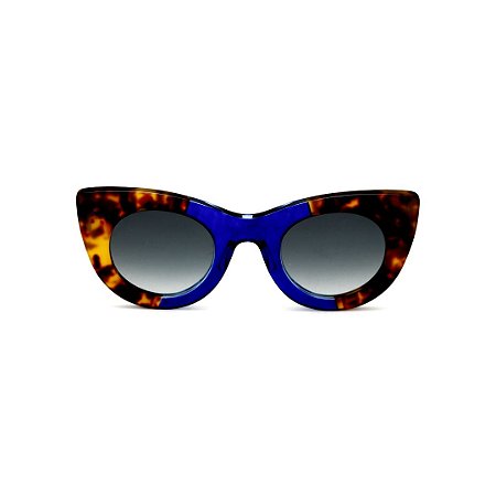Óculos de Sol Gustavo Eyewear G48 9. Cor: Animal print e azul translúcido. Haste marrom. Lentes cinza.