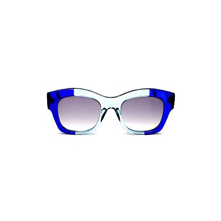 Óculos de Sol Gustavo Eyewear G58 11. Cor: Azul bic a acqua translúcido. Haste preta. Lentes cinza.