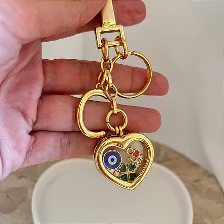 Chaveiro Capsula Com Pingentes Dentro Inicial Dourado