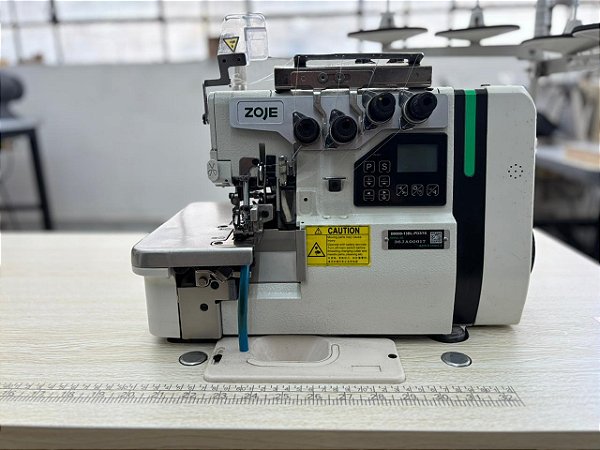 Overloque 4 fios DD eletronica c/ embutidor pneumático BK Usada MARCA: ZOJE / MODELO: ZJ-B9500-13BL-PD3