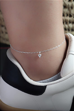 Tornozeleira prata com ponto de luz