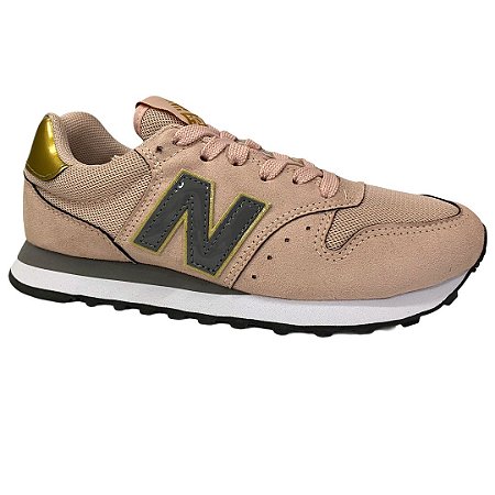 tenis new balance dourado