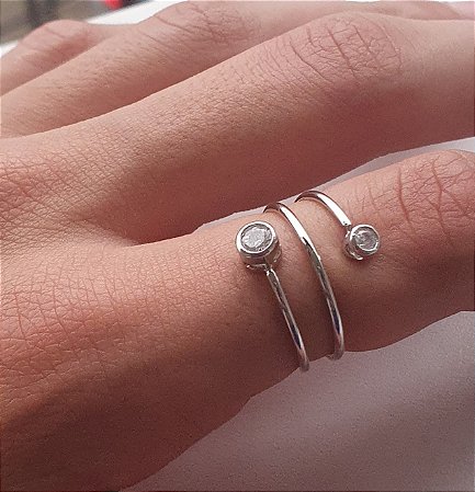ANEL AJUSTAVEL ESPIRAL COM PONTO DE LUZ BANHADO A OURO 18 K OU RODIO