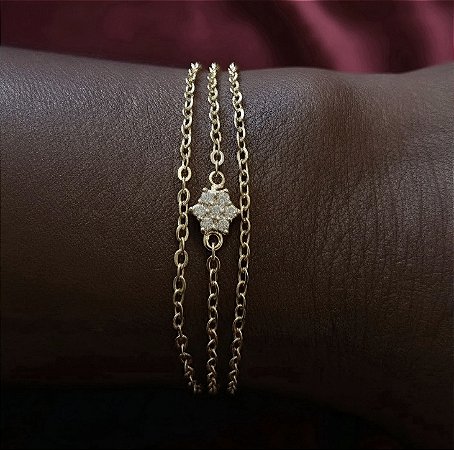 PULSEIRA CORRENTE TRIPLA COM UMA FLOR EM ZIRCONIA BANHADA A OURO 18 K
