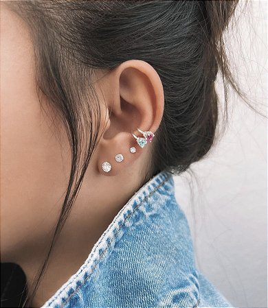 Piercing fake coração azul turquesa.