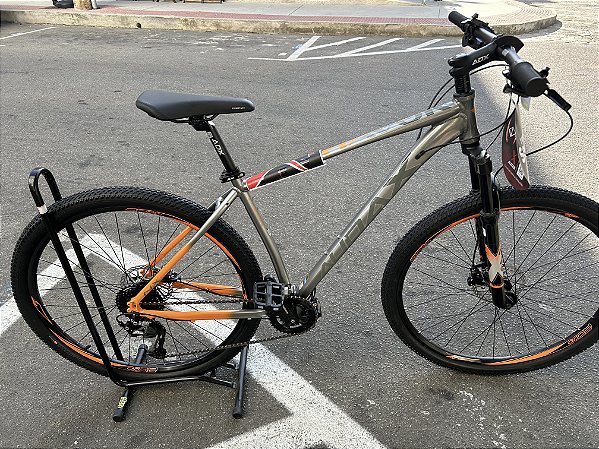 BICICLETA MTB ARO (29) AUDAX HAVOK NX SHIMANO ALIVIO 18V FREIO DISC HIDRÁULICO QUADRO 19 (G) COR INOX/LARANJA