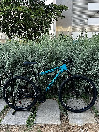 BICICLETA MTB ARO 29 FIRST ALUMINIO 21V IMPORTADO FREIO DISC MECÂNICO 19 (G) AZUL/PRETO