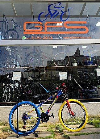 BICICLETA MTB FREERIDE ARO (26) PRO-X MANDRAKE KIT 21 VELOCIDADES FREIO DISC MECÂNICO COR AZUL/VERMELHO/AMARELO