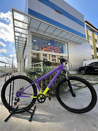 BICICLETA MTB ARO 29 TRACK 21V FREIO DISC MECÂNICO 15 (P) LILAS/AMARELO