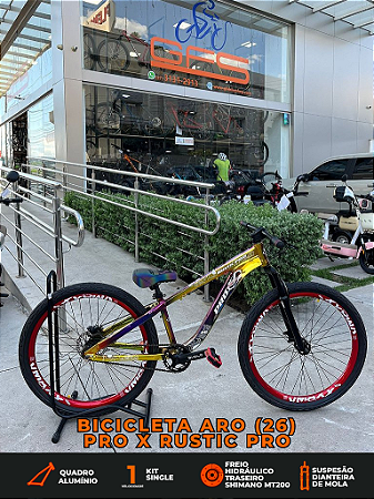 BICICLETA MTB FREERIDE ARO (26) RUSTIC PRO SEM MARCHA FREIO DISC HIDRÁULICO TRASEIRO COR CAMALEAO/VERMELHO