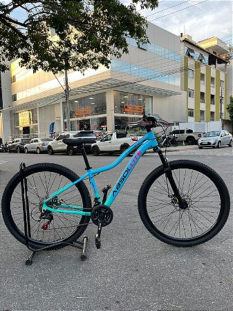 BICICLETA MTB ARO (29) ABSOLUTE HERA 21 VELOCIDADES FREIO A DISCO MECÂNICO TAMANHO 15 (P) COR AZUL/ROSA/VERDE AQUA
