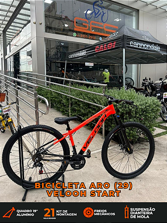 BICICLETA MTB ARO (29) VELOOH START 21 VELOCIDADES FREIO A DISCO MECÂNICO TAMANHO 19 (G) COR LARANJA/PRETO