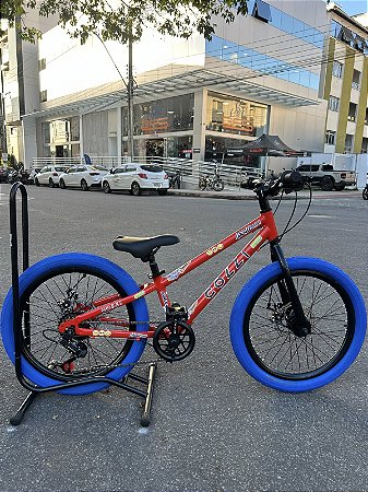 BICICLETA ARO (20) MTB COLLI GRAUZINHA 7 VELOCIDADES (1X7) FREIO A DISCO MECÂNICO COR VEMELHA PNEU AZUL