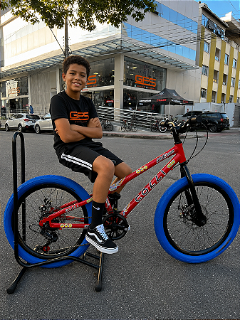 BICICLETA ARO (20) MTB COLLI GRAUZINHA 7 VELOCIDADES (1X7) FREIO A DISCO MECÂNICO COR VEMELHA PNEU AZUL