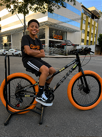 BICICLETA ARO (20) MTB COLLI GRAUZINHA 7 VELOCIDADES (1X7) FREIO A DISCO MECÂNICO COR PRETO FOSCO PNEU LARANJA
