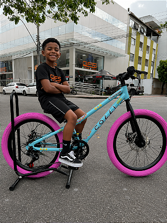 BICICLETA ARO (20) MTB COLLI GRAUZINHA 7 VELOCIDADES (1X7) FREIO A DISCO MECÂNICO COR CHAMPANHE PNEU PINK