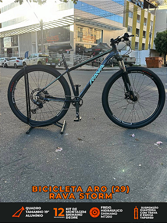 BICICLETA ARO (29) RAVA STORM KIT 12 VELOCIDADES (1X12) FREIO DISC HIDRAULICO SHIMANO MT200 TAMANHO 19 (G) CAMALEÃO