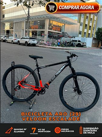 BICICLETA MTB ARO (29) VELOOH ESCALADE 7 VELOCIDADES (1X7) FREIO A DISCO MECÂNICO TAMANHO 19 (G) COR PRETO/LARANJA NEON